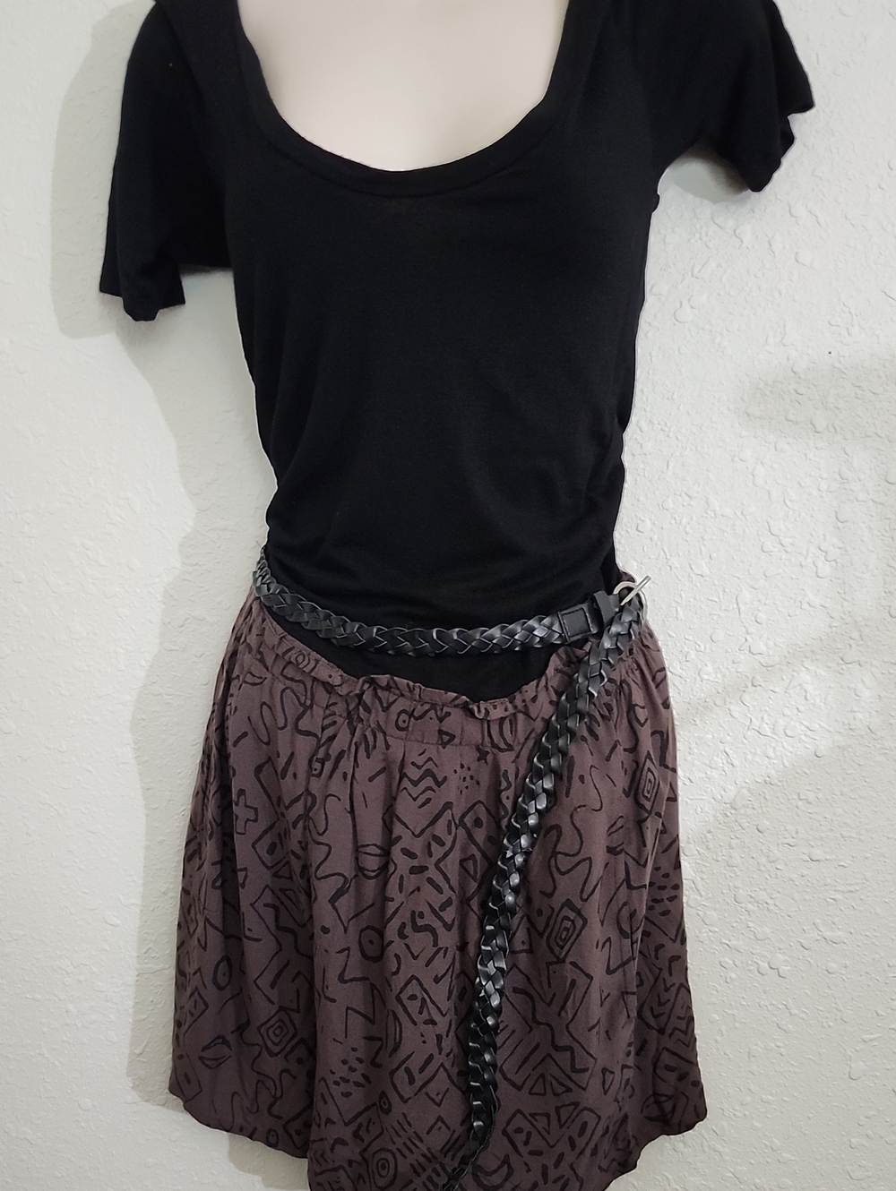Black Scoop Neck Tee with Patterned Brown Jumpsuite and Braided Belt Obey